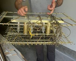 Modern chandelier has been taken down all the crystals have to be put back on