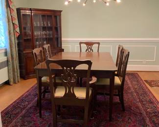 Dining room table with 2 extra leaves and the protective mats. Chairs sold separate. Many gorgeous Oriental hand knotted or hand woven rugs.