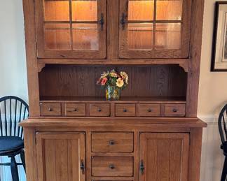 Broyhill Attic Heirloom Oak China Cabinet with lights on
