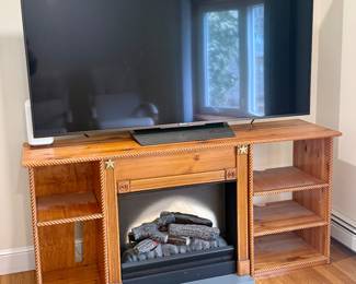 $175 - Wood TV stand with built-in electric “fireplace” heater; (TV not included)