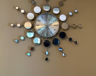 Modern silver sunburst wall clock