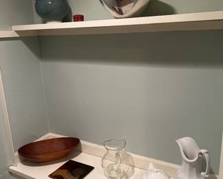 Various decorative items including Nambe bowl