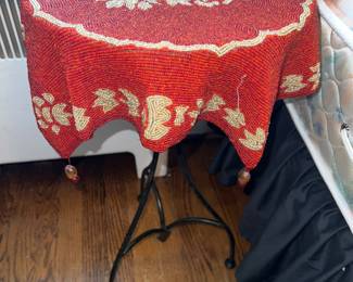 Vintage tablecloth on wrought iron legged table