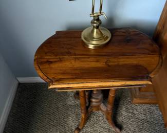 Victoria style pedestal table and brass desk lamp
