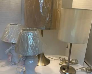 4 Lamp Lot  2 New Matching White Ceramic, 2 Silver Tone  All New Lamp Shades