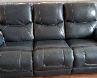 Navy leather couch with recliners on both ends