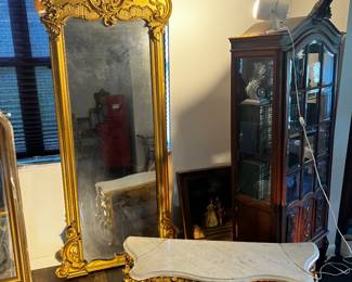 Antique style pier mirror with attached console shelf base, heavily carved Rococo scrollwork, giltwood and walnut finish, Hollywood Regency and Baroque influence, damage and restoration needed.