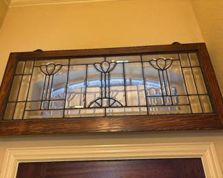 Beveled glass panel in wood frame