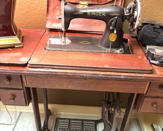 Singer machine in fold down cabinet