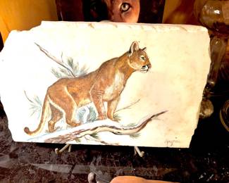 Signed painted mountain lion on stone