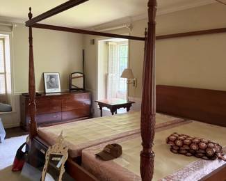Antique four-poster wooden bed frame