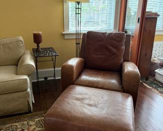 Leather recliner and a leather ottoman 