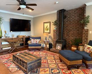 Downstairs, trunks, wicker, beautiful wool rug, etc