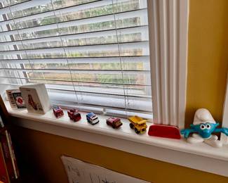 Cars, trucks, Smurf, books, harmonica 