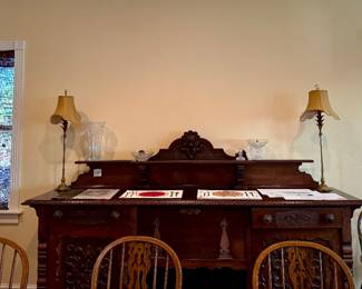 Antique walnut sideboard with art, crystal and very nice brass lamps, antique high chair 