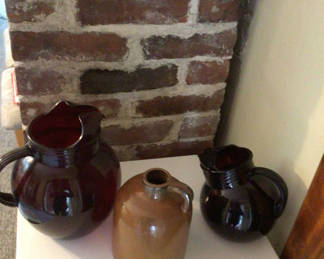 Lot 60: Three glazed ceramic jugs/pitchers