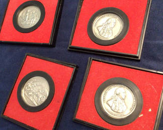 Lot 98: Silver medals in red presentation frames with America’s First Medals album