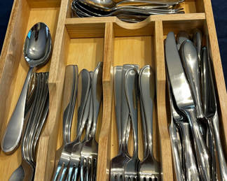 Lot 83: Wooden cutlery tray with forks, spoons, and knives