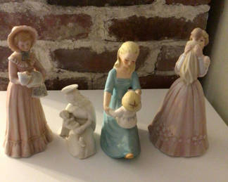 Lot 20: Set of four Enesco Treasured Memories porcelain figurines