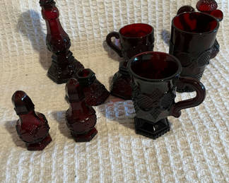 Lot 468: Cranberry red glassware collection (mugs, decanter/stand, and accessories)