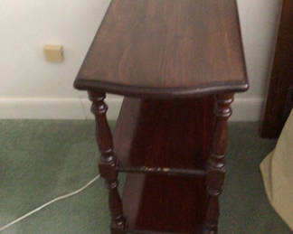 Lot 498: Dark wood three-tier end table