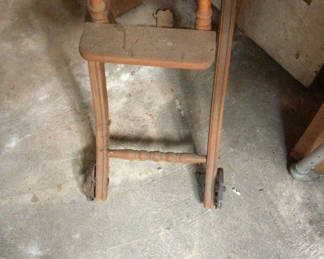 Lot 457: Vintage wooden high chair with tray and wheels