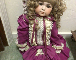Lot 495: Purple Victorian-style doll in lace dress and bonnet