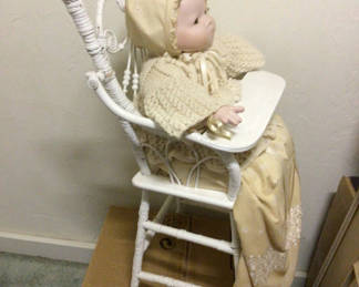 Lot 492: Doll in White Wicker High Chair