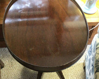 Lot 2: Round dark wood pedestal table with label tag