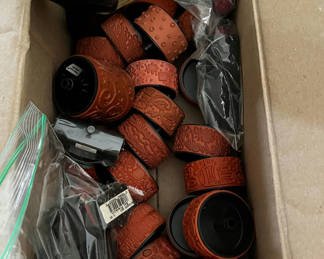 Lot 105: Assorted craft supplies: rubber stamps, embossed leather bracelets, and plastic fruit shapes