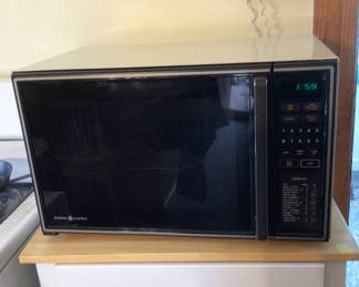 Lot 72: Black microwave oven with digital keypad