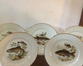 Lot 12: Fish-themed porcelain plates with gold rims