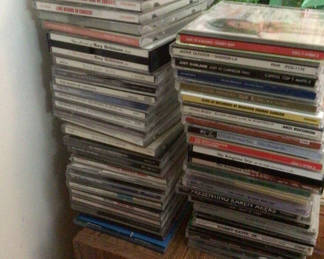 Lot 43: Stacks of CD jewel cases and music