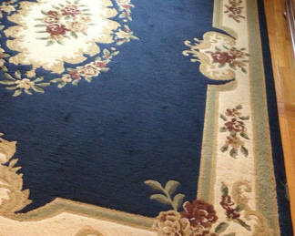Lot 49: Blue area rug with floral border and Plateau Abrissone Navy 