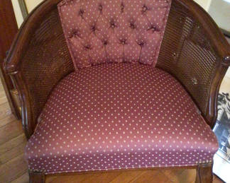 Lot 31: Vintage tufted armchair with caned sides