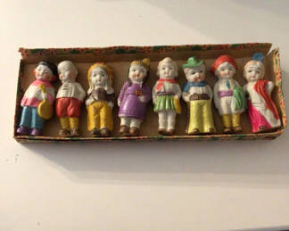 Lot 74: Ten colorful plastic figurines in varied outfits