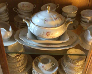 Lot 13: Floral porcelain dinnerware set with tureen