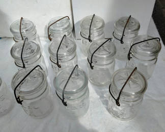 Lot 64: Dozen Atlas pint Mason Jars with  Bail & clamp closure