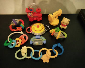 Lot 74: Assorted colorful baby toys and teething rattles
