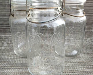 Lot 63: Three Bail & clamp Ball Mason quart jars 