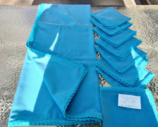 Lot 86: Blue tablecloth with eight crocheted-edged napkins