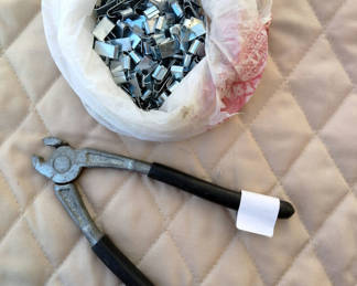 Lot 45: Pliers and bag of metal fasteners for cage construction