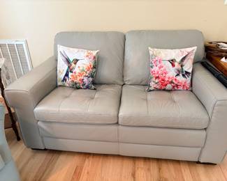 Gray leather love seat