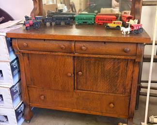 American Tiger Oak Sideboard (also called a buffet or server) dating from the late 19th century to early 20th century (Victorian or Golden Oak era).