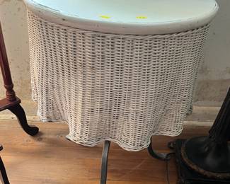 Wicker sided table with wrought iron base