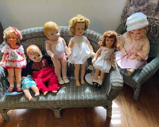 Child's wicker sofa and chair with new dolls in the "doll room"