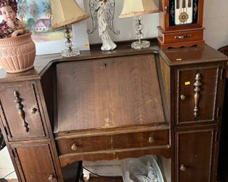 1930s drop front desk with 2 cupboards on each side and a center drawer