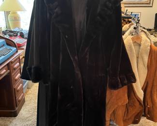 Fake fur coats on center room display