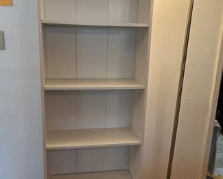 Tall, white shelf and nice floor lamp