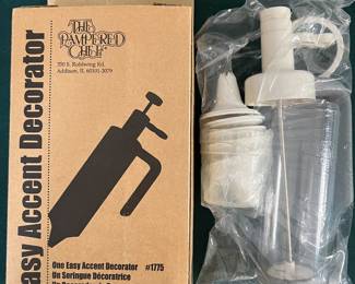Lots of pampered chef kitchen items at the sale that are new in their original boxes!